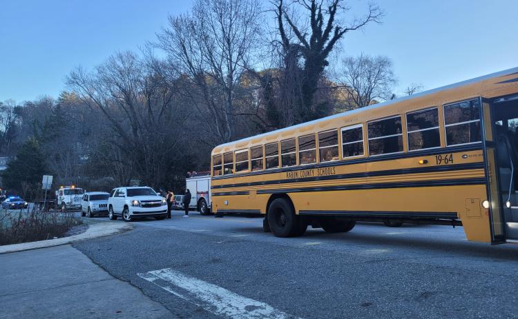 Megan Broome/The Clayton Tribune. A Rabun County school bus was involved in a four-vehicle accident in Clayton Monday morning. No injuries were reported from the accident. A Clayton man is charged with DUI and failure to maintain lane as a result.