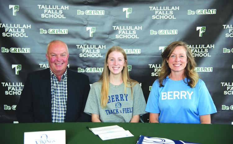 Photo courtesy Austin Poffenberger. Seated with her parents, Macy Murdock of Tallulah Falls signs her letter of intent on Jan. 13 to compete in track and field with Berry College.