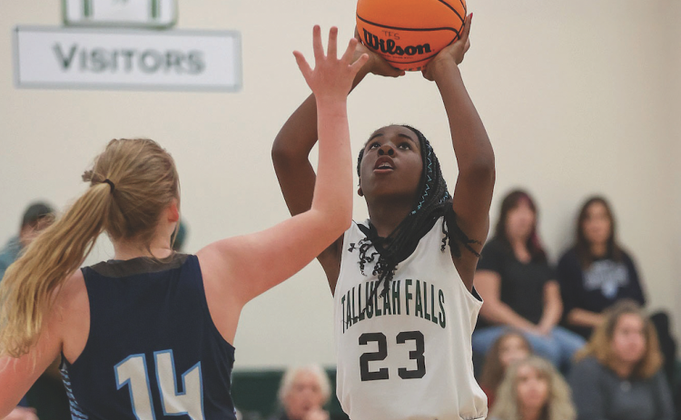 Photo courtesy of Austin Poffenberger. TFS’s Narissa Dawson elevates her shot for the Lady Indians.