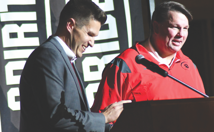 Enoch Autry/The Clayton Tribune. RCHS Principal Justin Spillers, left, introduces Michael Davis as the new head football coach at RCHS Thursday. Davis served as the Offensive Coordinator and Quarterbacks Coach for the Wildcats in 2021.