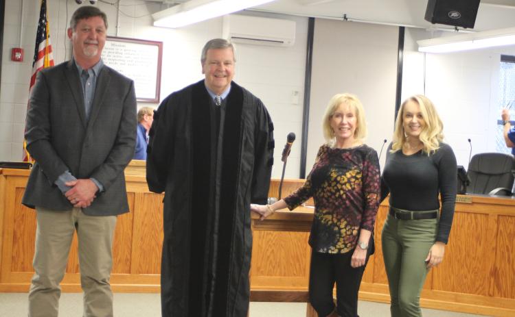 Megan Broome/The Clayton Tribune. Clayton candidates for mayor and council member positions elected Nov. 2 were sworn-in to office Monday by Probate Judge Carlton H. Jones III. Mayor Kurt Cannon, left, Probate Judge Carlton H. Jones III, Council Member Althea Bleckley and Council Member Amanda Harrold pose for photographs following the ceremony.