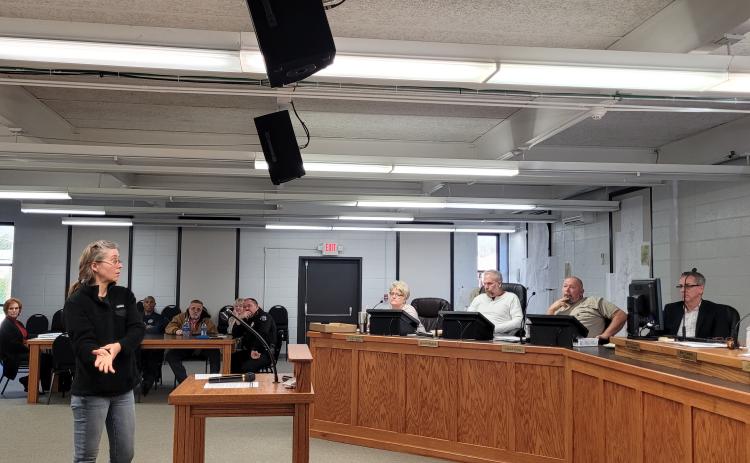 Megan Broome/The Clayton Tribune. Nicole Hayler, executive director of Chattooga Conservancy, addressed council members about a blocked culvert that channels Stekoa Creek under Chechero Street.