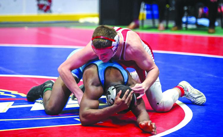 Submitted photo. Wildcat junior Miles Watts gets the advantage on his opponent Chris Mance of Lovett in the 152-pound Class AA wrestling championship match. Watts would ultimately fall to Mance in a 5-4 decision to become the state runner-up.