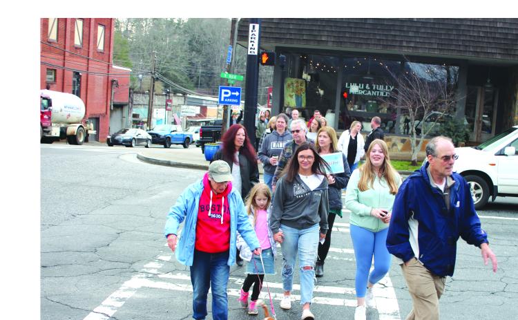 Megan Broome/The Clayton Tribune. Community members participate in a Mental Health March hosted by Georgia Mountain Psychological Associates Feb. 22. The march and candlelight service were held to remember those who have lost their lives to mental illness.