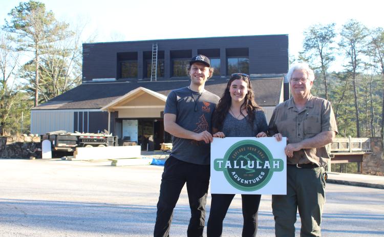 Megan Broome/The Clayton Tribune. Tallulah Adventures, LLC is coming to Tallulah Falls this summer. A soft opening will be held in the summer of 2022 and a grand opening is planned for the fall. Kyle Jerome, food service manager, left, Spencer Turk, with business development, and Bill Turk, managing member, stand in front of the old Georgia Power building that is being repurposed for the business a couple weeks ago. Crew members have continued the process of repurposing the facility.