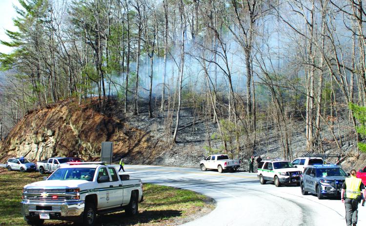 Megan Broome/The Clayton Tribune. The cause of a Highway 246 fire in Sky Valley remains unknown. A separate brush fire started across the state line in North Carolina.