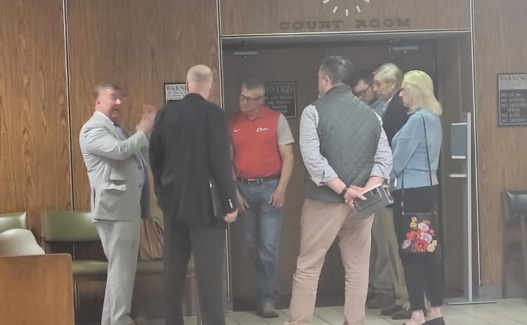 Rabun County Attorney Allyn Stockton talks with a group of people after a trial in Superior Court March 31, following the court's decision to overrule an approval by the Rabun County Board of Commissioners May 25, 2021 to rezone property on Bridge Creek Rd. from Agricultural (A) to Commercial Business (CB). Pictured are Stockton with Matt Mitcham; Darrin Giles, Rabun County administrator; Brian Parker; Elizabeth Gill; Chip Groom, president of LBCA; and Shylan Wood, County planning and zoning administrator.