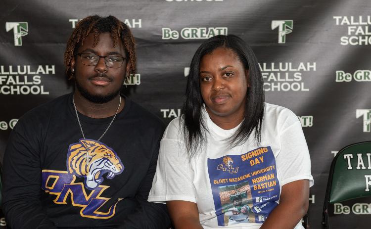 Photo by Lane Gresham. Norman Bastian who signed a national letter of intent to play baseball at Olivet Nazarene University poses for a photograph with his mother Alexandria Gabriel on the Tallulah Falls campus on March 23.