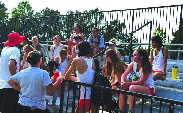 Enoch Autry/The Clayton Tribune. The Rabun County coaches Bryann Getty and Jenn Ramey talk with their Ladycat tennis players after their May 5 loss at Pace Academy  in the Class AA state Final Four. The RCHS season was the best ever for the program as the girls reached the semifinals for the first time ever.