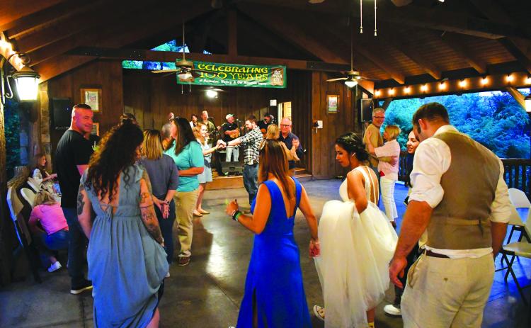 Enoch Autry/The Clayton Tribune. Guests head to the dance floor to celebrate the 100th anniversary of Lake Rabun Hotel.