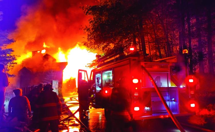 Photo courtesy of Conner Horn. Rabun County Fire Services continue to fight a three-story house fire on Lake Rabun Monday night. Crews remained on the scene into the morning hours. The fire could be seen for miles. The vacation house was deemed a complete loss.