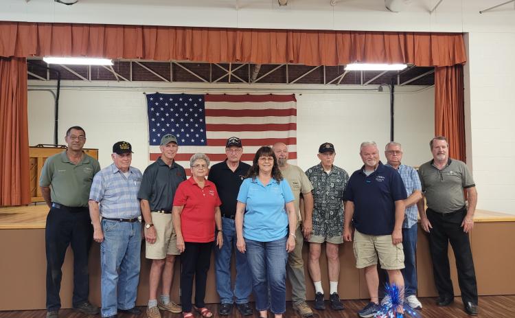 Megan Broome/The Clayton Tribune. Pictured are Council Member Michael Holt, left; veteran Doug Wayne; veteran Jon Jones; Mayor Grace Watts; veteran Gary Cantwell; Council Member Brenda Hooper; veteran David Cross; veteran David Ruth; Council Member Robert Sutton; veteran Bill Fountain and veteran Chris DiNofrio. Not pictured is Council Member Eric McCrackin.