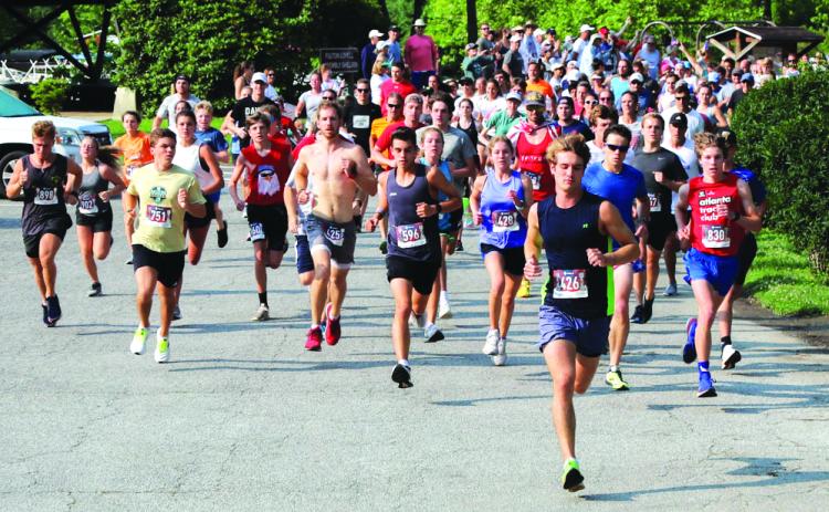 Photo courtesy of  Melissa Elzey. Runners begin last year’s Lake Burton Fun Run at the Moccasin Creek pavilion in Clarkesville. Annually, a total of 1,250 participate.