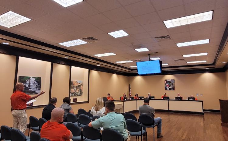 Megan Broome/The Clayton Tribune. Scott Crane, safety coordinator for Rabun County Schools, addresses Board of Education members at the July 21 meeting to go over safety protocols for the upcoming school year.