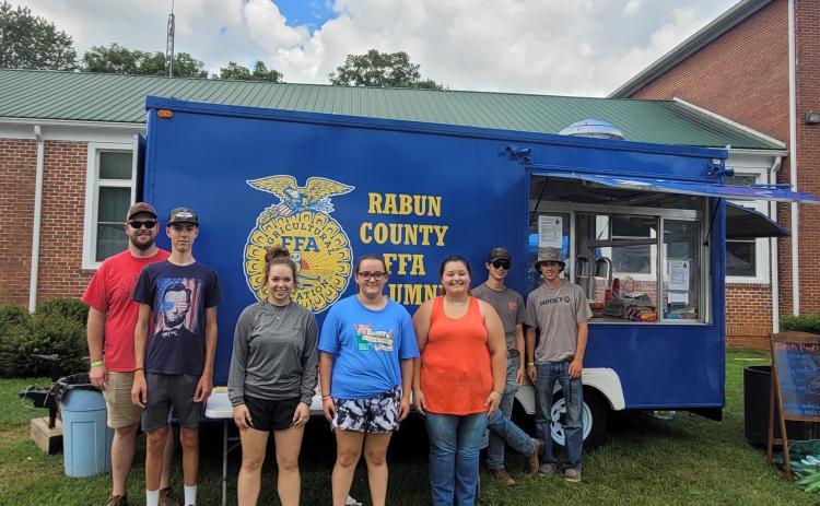 Megan Broome/The Clayton Tribune. Rabun County FFA served up good food at the 25th Dillard Bluegrass and Barbeque Festival August 5 and 6. Pictured are Rabun County FFA members James Hale, instructor; Noah Thurmond; Loren Mazarky; Ashlyn Dixon; Jalynn Pendry; Jonathan Aughtman; and Ethan Mazarky. Not pictured are Peyton Hicks; Eli Owens; and Melanie Beck.