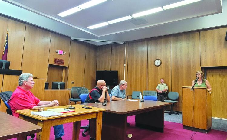 Megan Broome/The Clayton Tribune. Rabun County resident Lori Gamble-Barrett speaks to commissioners about questions and concerns regarding a projected county property tax increase of 11.14 percent during a public hearing on Aug. 11.