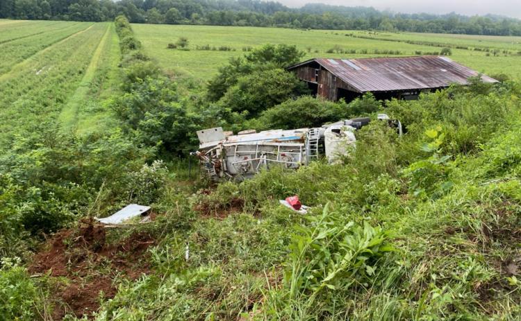 Photo courtesy of Brian Panell/Rabun County EMA Director. A 2015 Mack Granite carrying “blasting agents” overturned on its side early Tuesday morning at Kellys Creek Road in Rabun Gap.