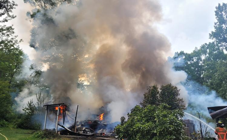 Megan Broome/The Clayton Tribune. Rabun County Fire Services work the scene of a structure fire on Flint Mountain Lane in Tiger Aug. 19. No injuries were reported.