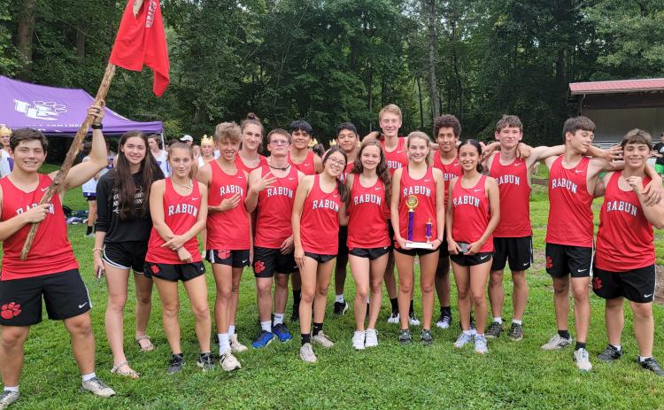 Submitted photo. The Rabun County High School cross country team celebrates the efforts of the Lady Cats. Because of lightning in the area the boys were not able to complete the course.