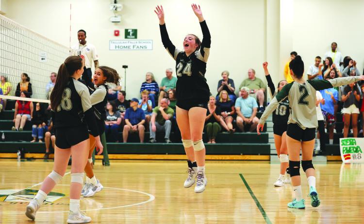 Courtesy of Austin Poffenberger. Addy McCoy (middle) celebrates as TFS varsity goes 4-0 during the week.