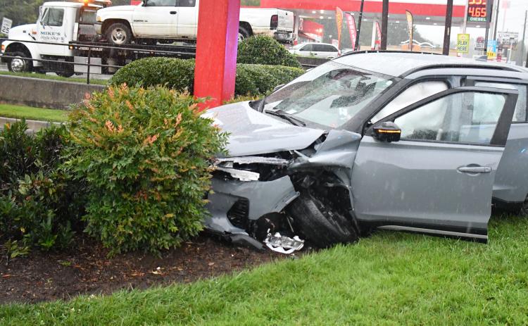 Megan Broome/The Clayton Tribune. This 2022 Silver Nissan Kicks crashed into the bushes beside the Chick-fil-A sign on Sunday, Sept. 4 following a two-vehicle crash in Clayton.