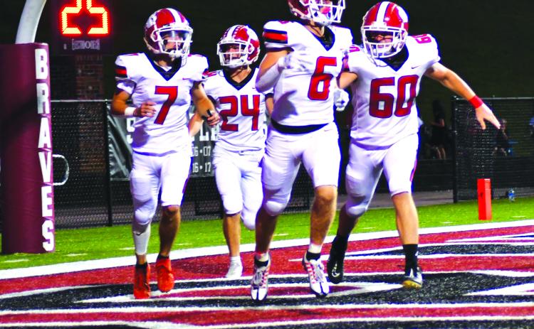 Enoch Autry/The Clayton Tribune. Rabun County’s Jaden Gibson (6) receives congrats from Braxton Brady (60), Lang Windham (7), and Riley Stewart (24) after the senior receiver scores the first of his two TDs in the win.