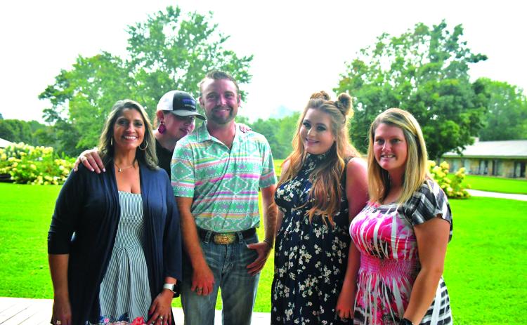 Megan Broome/The Clayton Tribune. Jo Flores, Natalie Dillard, Hunter Grayson, Ashley Cabe and Andria Robinson enjoy Labor Day weekend at The Dillard House on Sept. 4 with a BBQ cookout and live music performed by Grayson. The event promoted tourism to the area and brought the community together.