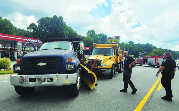 Megan Broome/The Clayton Tribune. Emergency personnel work the scene of a two-vehicle crash on Georgia 15 in front of RaceTrac in Clayton.