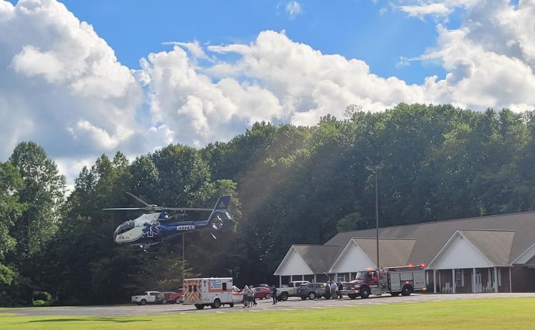 Megan Broome/The Clayton Tribune. A 71-year-old woman  is transported by AirLife after being struck by a vehicle on Aug. 25.