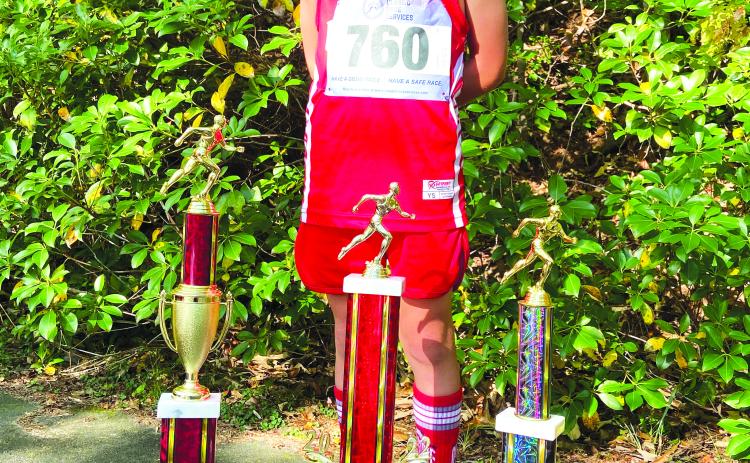 Courtesy of Ed Eidson. Kai Hanifan-Wagner, winning every meet this season, shattered the state record by 21 seconds. Last week he also earned the Highpoint championship with a perfect score of 75.