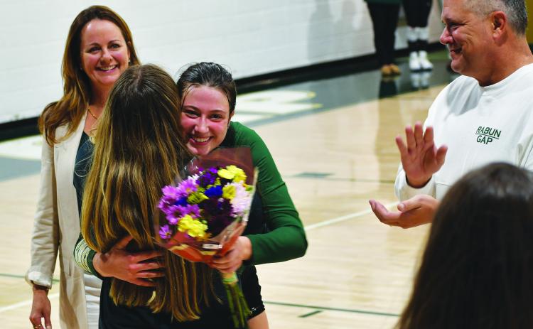 Luke Morey/The Clayton Tribune. RGNS volleyball three seniors Claren Spivey, Cheney Moriarty and Calea Jakson were honored by head coach Zoe Kennedy and Amy Westbrook on Oct. 12.