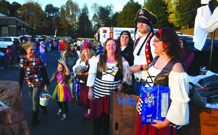 Enoch Autry/The Clayton Tribune. Employees from Walmart changed things up as these pirates gave out candy instead of taking.