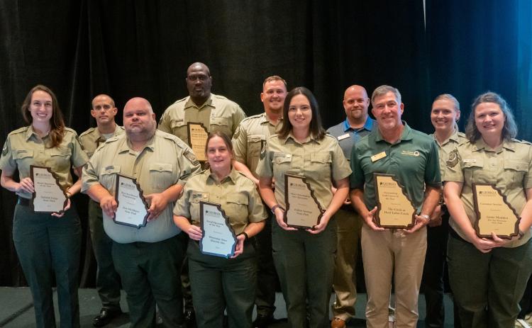 Submitted photo. Pictured are honored park and historic site managers Lieren Merz, Bud Fuller, Jason Carter, Desmond Timmons, Gretchen Greminger, Tyler Sims, Katherine Darsey, Chris Lockwood, Karl Gross, Carol Sanchez and Jamie Madden. Merz (far left) is the manager with Tallulah Gorge State Park and Tallulah Falls, which tied with Wormsloe State Historic Site for the “Retail Award.”