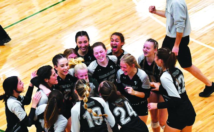 Luke Morey/The Clayton Tribune. Coach Matt Heyl and his team celebrate their first state championship apperarance in school history.