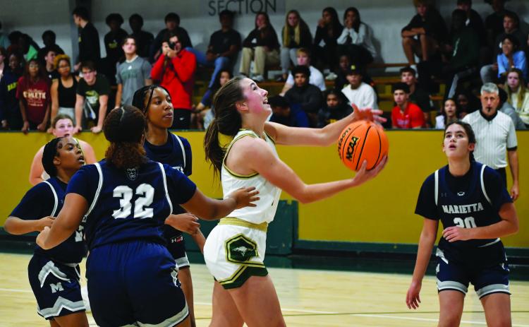 Luke Morey/The Clayton Tribune. Junior Sofia McNabb goes up for a basket in the scrimmage against Marietta on Wednesday night. McNabb had 13 points against North Oconee on Saturday for the Eagles’ first win of the season.