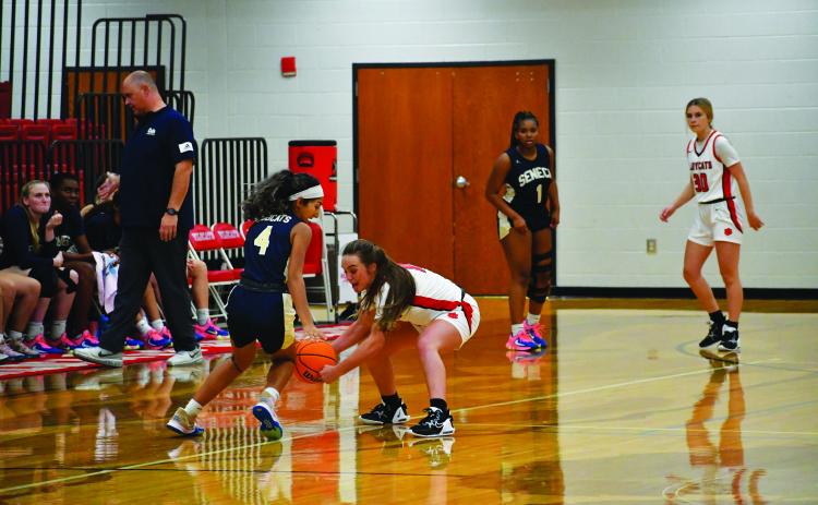 Luke Morey/The Clayton Tribune. Junior Mili Watts steals the ball in the scrimmage against Seneca last Thursday night. Watts had three steals along with 13 points and three assists.