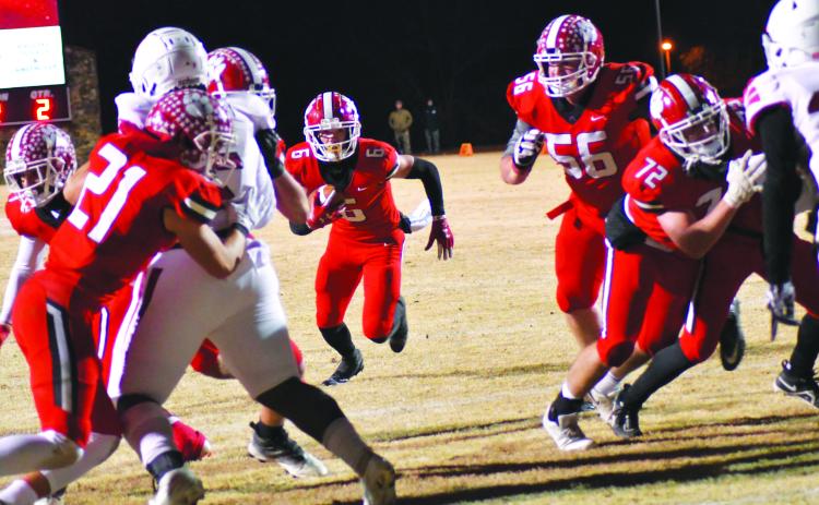 Enoch Autry/The Clayton Tribune. Rabun County senior wide receiver Jaden Gibson takes a direct snap for a two-yard rushing touchdown.  Gibson also added two receiving touchdowns on 10 catches for 201 yards. After winning 42-0 against Social Circle, RCHS will travel to take on Swainsboro on Friday, Nov. 25. The kickoff for the quarterfinal matchup between two ranked teams will be at 7 p.m.