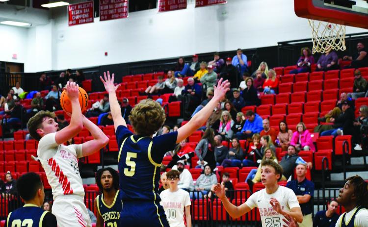 Luke Morey/The Clayton Tribune. Junior Cooper Welch hits a jumper against Seneca on Thursday. Welch will be leading the team as the sole returning starter to the squad.