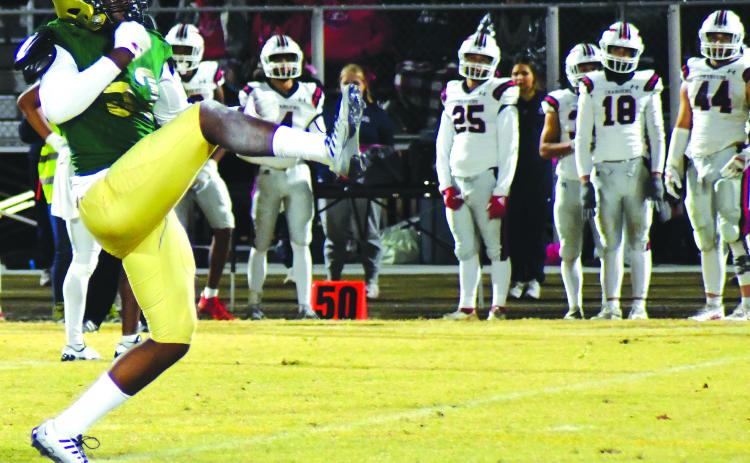 Enoch Autry/The Clayton Tribune. Eagle junior Gideon Herbert reacts to a sack in a prior game against Providence Day. The playoffs start Friday at home.