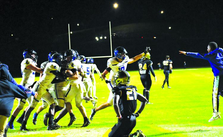 Luke Morey/The Clayton Tribune. Rabun Gap sophomore cornerback Onis Konanbonny falls to his knees after Charlotte Christian converted a last-second Hail Mary to advance to the state championship game.