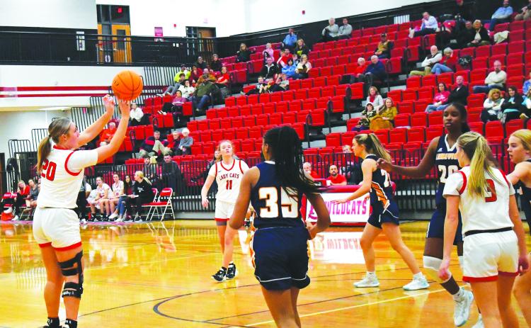 Luke Morey/The Clayton Tribune. Junior Ellie Southards hits a shot in the first quarter of the game against Lakeview as junior Lucy Hood (11)  looks on. Southards had 22 points on Wednesday, Dec. 21 to help the Lady Cats win 91-39.