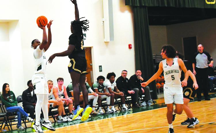Luke Morey/The Clayton Tribune. TFS senior Anfernee Hanna hits a three against Commerce on Friday, Jan. 13. Hanna had 17 points as TFS split their games over the weekend, falling to Prince Avenue Christian on Saturday.