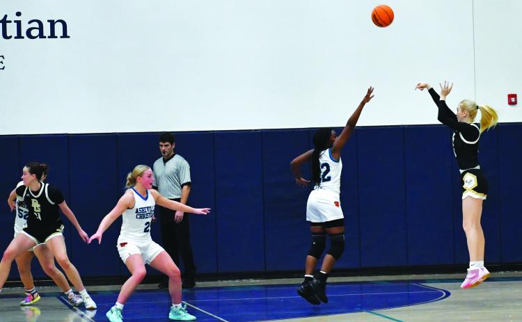 Luke Morey/The Clayton Tribune. RGNS junior Monna Julkunen puts up a shot against Asheville Christian Academy on Thursday, Feb. 2. Julkunen ended with 12 points as the Lady Eagles won 55-33.
