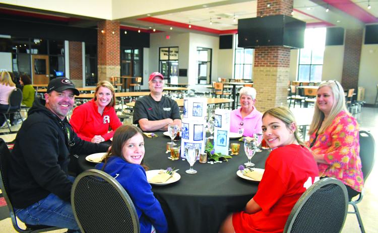 Megan Broome/The Clayton Tribune. Pictured clockwise are Tony Lima with spouse and board member Molly Lima; board member Curt Haban; Kitty Panell, secretary for superintendent; Dr. April Childers, Rabun County Schools superintendent; Ella Lima; and Bristol Lima.