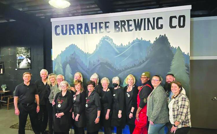 Submitted photo. Volunteers at the Currahee Brewing Company nonprofit night March 2 show support to the Food Bank of Northeast Georgia Food 2 Kids Program as the community came out and raised $2,900.