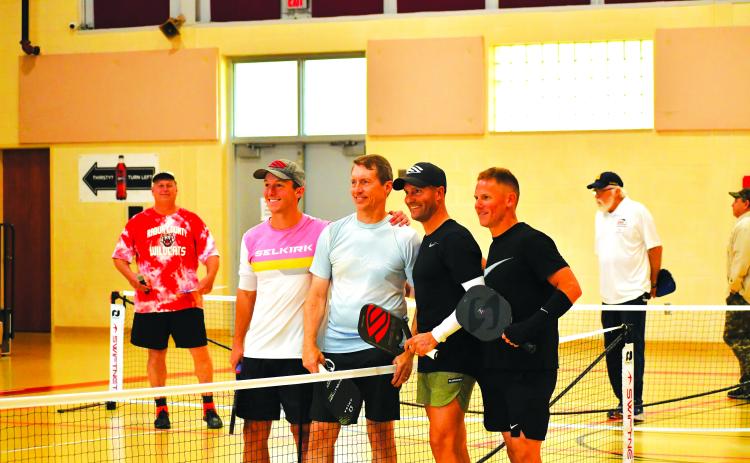 Luke Morey/The Clayton Tribune. The Rabun County Recreation Department hosted the first professional pickleball exhibition in North Georgia, with professionals playing singles and doubles matches on Sunday, March 5. Pictured from left in the foreground are Shea Underwood, David Spearman, Mark Price and David Hebert. After the event, Price led a three-day pickleball camp.