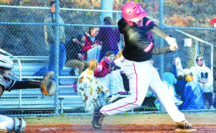 Luke Morey/The Clayton Tribune. Rabun County’s Parker Smith gets a hit against Elbert County on Tuesday, March 14 in the seventh inning. Smith later scored as a part of a late rally from the Wildcats that ultimately fell short with Elbert County winning 9-5. The Wildcats next travel to Elberton for a double header on Friday, March 17.