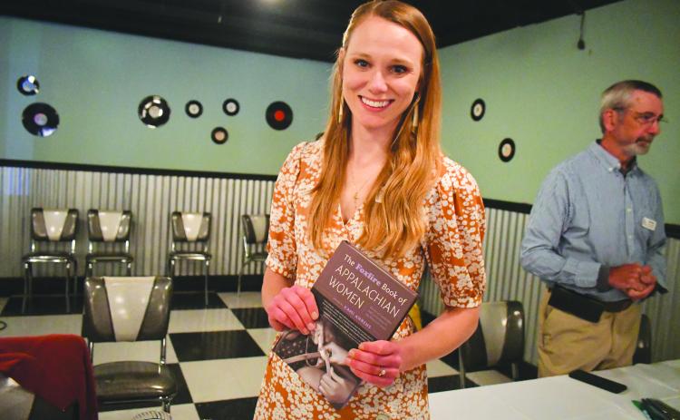 Megan Broome/The Clayton Tribune. Kami Ahrens, curator and director of education for Foxfire, is excited to hold a book launch event for the book she wrote and edited titled “The Foxfire Book of Appalachian Women: Stories of Landscape and Community in the Mountain South.” Crowds of people attended the event held at the Rabun County Civic Center Diner.