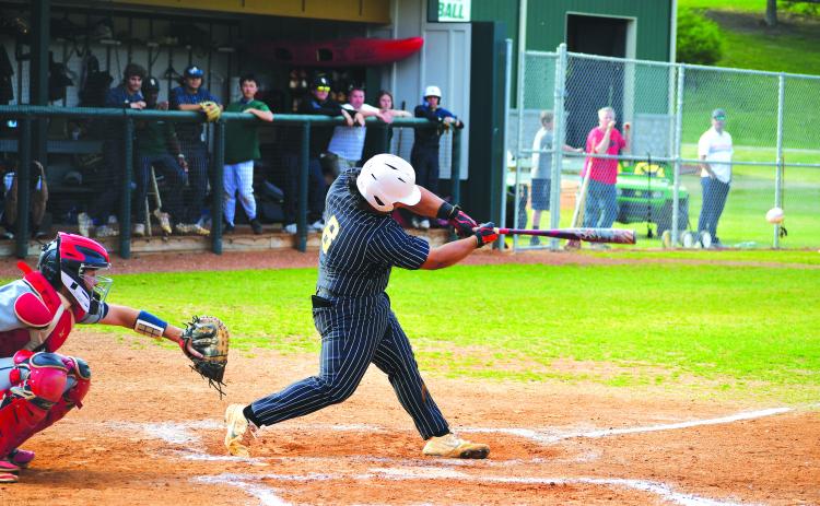 Luke Morey/The Clayton Tribune. Rabun Gap sophomore Jeffrey Diaz hits a double against Asheville Christian Academy on Thursday, April 6. Diaz also hit a home run on Tuesday, April 4 to help the Eagles win four straight games.