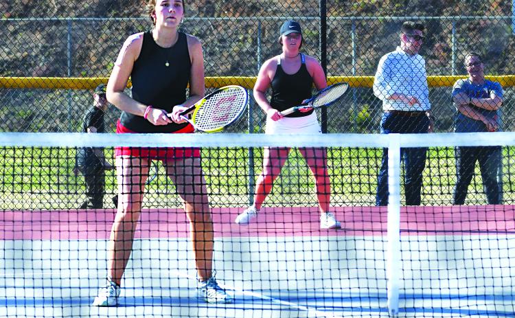 Luke Morey/The Clayton Tribune. Sophomore Ruby Richardson (left) and senior Allana Jones helped the Rabun County tennis team win the region semi-final round, facing off against Tallulah Falls in the championship on Wednesday, April 12.